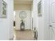 Inviting entryway with neutral colors, tiled floors, and art, creating a warm and welcoming ambiance at 2815 Shelburne Way, St Cloud, FL 34772