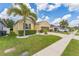 Inviting exterior showcasing a well-kept lawn, tidy landscaping, and a welcoming front facade at 2815 Shelburne Way, St Cloud, FL 34772