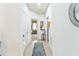 Well-lit hallway with access to the bedroom, showing tiled floors and a serene atmosphere at 2815 Shelburne Way, St Cloud, FL 34772