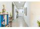 Bright hallway with tile floors, art, and trophy decor, adding character and charm to the interior at 2815 Shelburne Way, St Cloud, FL 34772