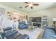 Cozy living room featuring leather sofas, mirrored entertainment center, and an open layout at 2815 Shelburne Way, St Cloud, FL 34772
