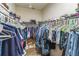 Spacious walk-in closet with ample hanging space for clothes and shelving for shoes and accessories at 2815 Shelburne Way, St Cloud, FL 34772