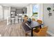Stylish dining area with a modern table, comfortable seating, and plenty of natural light enhancing the space at 2823 Camellia Flower St, Apopka, FL 32703
