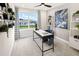 Well-lit home office featuring a modern desk, comfortable chair, and ample natural light at 2831 Camellia Flower St, Apopka, FL 32703