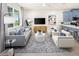 Bright open concept living room with a kitchen island, furniture, and large windows at 2831 Camellia Flower St, Apopka, FL 32703