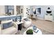 Open concept living room with kitchen island, dining area, and lots of light at 2831 Camellia Flower St, Apopka, FL 32703