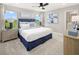 Bright main bedroom featuring plush carpet, two large windows, and an ensuite bathroom at 2831 Camellia Flower St, Apopka, FL 32703