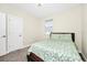 This carpeted bedroom features a window for natural light and a neutral wall color at 2919 Verse St, Kissimmee, FL 34746