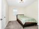 This carpeted bedroom features a window for natural light and a neutral wall color at 2919 Verse St, Kissimmee, FL 34746