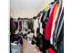 Walk-in closet providing ample storage with clothing racks and additional space for organization at 2919 Verse St, Kissimmee, FL 34746