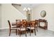 Spacious dining room with elegant chandelier, stairway access, and stylish furnishings at 2919 Verse St, Kissimmee, FL 34746