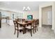Bright dining room with wood table, six chairs, and seamlessly connects to the living area at 2919 Verse St, Kissimmee, FL 34746