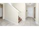 Inviting foyer with tile flooring, staircase, and a view of the front door at 2919 Verse St, Kissimmee, FL 34746
