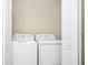 Functional laundry room with modern washer and dryer units at 2919 Verse St, Kissimmee, FL 34746