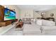 Comfortable living room features a large sectional sofa and mounted television at 2919 Verse St, Kissimmee, FL 34746