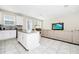 Open living space with a modern kitchen island flowing into the comfortable living area and dining space at 2919 Verse St, Kissimmee, FL 34746