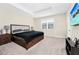 Spacious main bedroom offers a tray ceiling, plush carpeting, and a serene ambiance at 2919 Verse St, Kissimmee, FL 34746