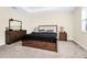 Bright main bedroom with a large bed, carpeted floors, a window and natural light at 2919 Verse St, Kissimmee, FL 34746