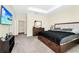 Comfortable main bedroom with TV, closet, a black bedspread, and plush carpeting at 2919 Verse St, Kissimmee, FL 34746