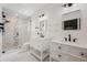 Modern bathroom with dual vanities, a glass-enclosed shower, and elegant black fixtures at 3011 Temple Trl, Winter Park, FL 32789