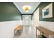 Inviting foyer with hardwood floors, elegant lighting, wainscoting, and decorative accents at 3011 Temple Trl, Winter Park, FL 32789