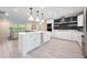 Spacious kitchen with a marble island, stainless appliances, and an open layout connecting to the living area at 3011 Temple Trl, Winter Park, FL 32789