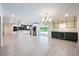 Bright kitchen features a center island, stainless appliances, and sliding glass doors to the backyard at 3011 Temple Trl, Winter Park, FL 32789