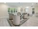 Spacious living room with natural light, showcasing hardwood floors and comfortable seating arrangements at 3011 Temple Trl, Winter Park, FL 32789