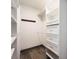 Organized walk-in closet with custom shelving and drawers for optimal storage at 3011 Temple Trl, Winter Park, FL 32789
