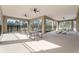 Covered outdoor area with picnic tables and ceiling fans for relaxation and enjoyment at 3310 Arch Ave, Ormond Beach, FL 32174