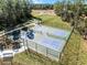 Aerial view of community pickleball courts, set in a beautifully landscaped environment with walking paths at 3310 Arch Ave, Ormond Beach, FL 32174