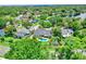 Beautiful aerial view of a backyard with a sparkling pool and lush landscaping, set in a serene neighborhood at 370 Brushwood Ln, Winter Springs, FL 32708