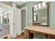 Bathroom offers an open vanity and access to the pool through French doors at 370 Brushwood Ln, Winter Springs, FL 32708