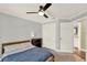 Cozy bedroom with a bed, carpet, and ceiling fan, perfect for relaxing and resting at 370 Brushwood Ln, Winter Springs, FL 32708
