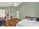 Spacious bedroom with vaulted ceiling features hardwood floors and ample natural light from a large window at 370 Brushwood Ln, Winter Springs, FL 32708