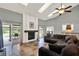 Spacious living room features a fireplace, sliding glass doors, and easy access to other rooms at 370 Brushwood Ln, Winter Springs, FL 32708