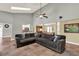 Spacious living room with high ceilings, skylights, neutral tones, and a stylish sectional sofa at 370 Brushwood Ln, Winter Springs, FL 32708