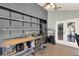 Bright office features shelving, storage, and double doors to outside at 370 Brushwood Ln, Winter Springs, FL 32708