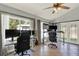 Bright office space with tiled floor, ceiling fan and multiple monitors for a perfect work-from-home setup at 370 Brushwood Ln, Winter Springs, FL 32708