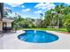 Beautiful in-ground pool with lush landscaping and a patio, perfect for outdoor entertainment at 370 Brushwood Ln, Winter Springs, FL 32708
