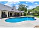 Beautiful backyard pool featuring a spa and a covered patio area, perfect for entertaining and relaxation at 370 Brushwood Ln, Winter Springs, FL 32708