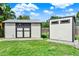 Backyard shows two convenient sheds providing extra storage space at 370 Brushwood Ln, Winter Springs, FL 32708