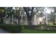 Stately building exterior with classic columns and lush landscaping, exuding sophistication and charm at 3700 Plantation Blvd, Leesburg, FL 34748