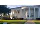 Stunning building featuring grand columns, lush lawns, and mature trees, creating a serene atmosphere at 3700 Plantation Blvd, Leesburg, FL 34748