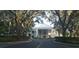 Elegant building exterior with grand columns and a well-manicured lawn, showcasing timeless beauty at 3700 Plantation Blvd, Leesburg, FL 34748