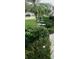 Beautifully landscaped front yard with a decorative water fountain and lush greenery at 3700 Plantation Blvd, Leesburg, FL 34748