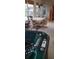 This image captures a hot tub on a porch with a table and chairs, creating a relaxing and inviting atmosphere at 3700 Plantation Blvd, Leesburg, FL 34748