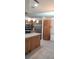 Spacious kitchen with stainless steel appliances, ample cabinetry, and an island at 3700 Plantation Blvd, Leesburg, FL 34748