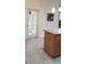 Bright kitchen with tile flooring, stainless appliances, and a door leading to the outside at 3700 Plantation Blvd, Leesburg, FL 34748