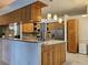 Spacious kitchen showcasing wood cabinets, stainless steel appliances, and kitchen island at 3700 Plantation Blvd, Leesburg, FL 34748